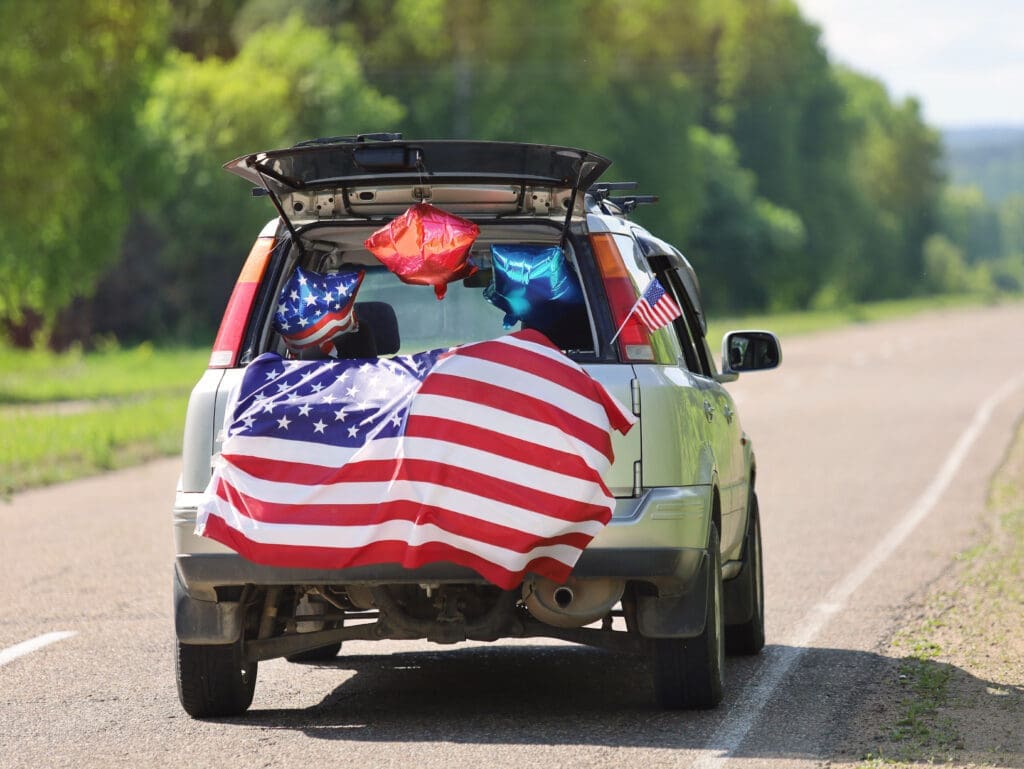 Car with American Flag in honor of Fourth of July Holiday